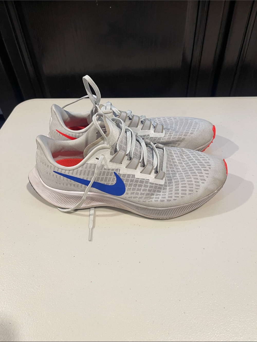 Nike White Mesh Sneakers with Blue Swoosh and Coral Accents